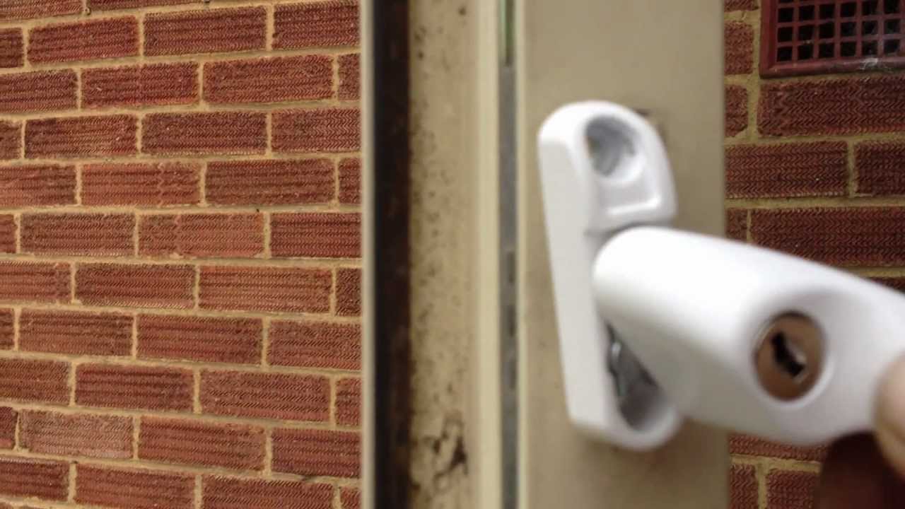Window handle with lock and key.